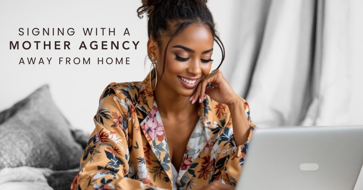 Signing with a Mother Agency Away from Home – A woman in a floral robe working on her laptop, representing the process of securing agency representation remotely.